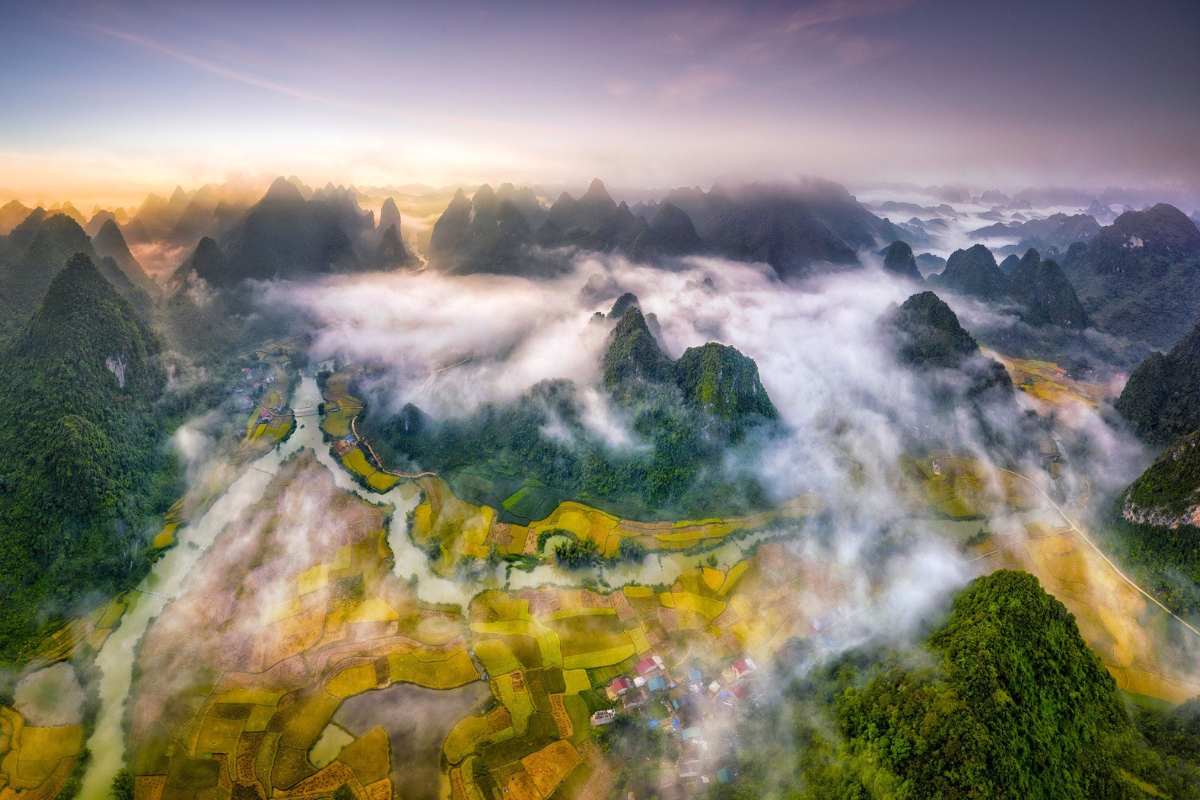 Breathtaking view of Phong Nam Valley with rice fields and limestone mountains