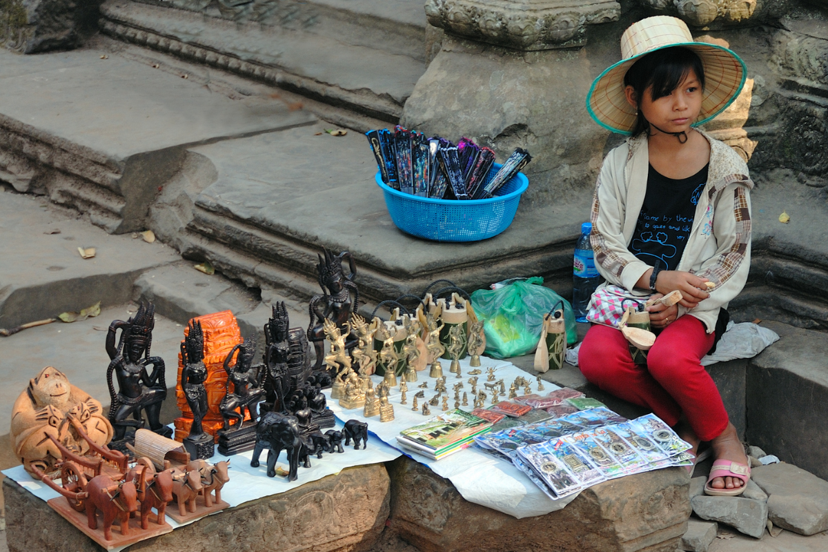 A Local Girl Waiting For Customers buying Goods