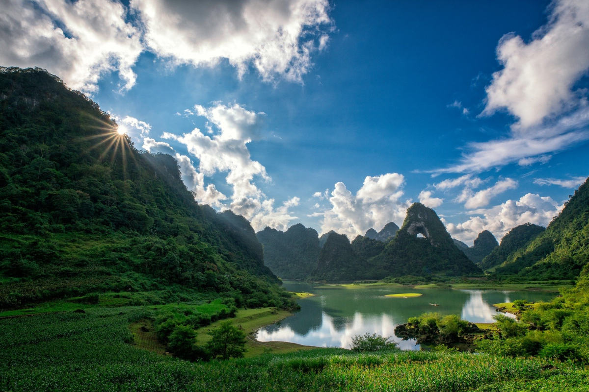 Hidden mountain village surrounded by green rice fields in Cao Bang