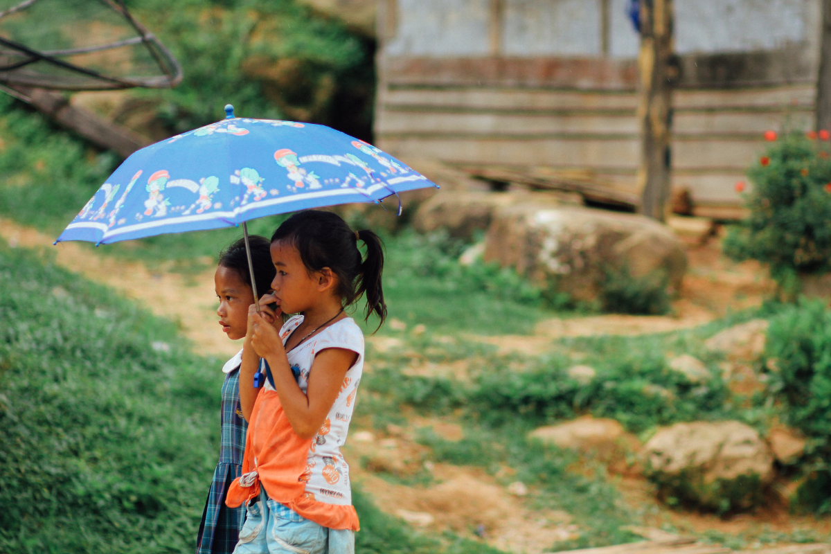 People in Rainy Season in Laos - World Mate Travel