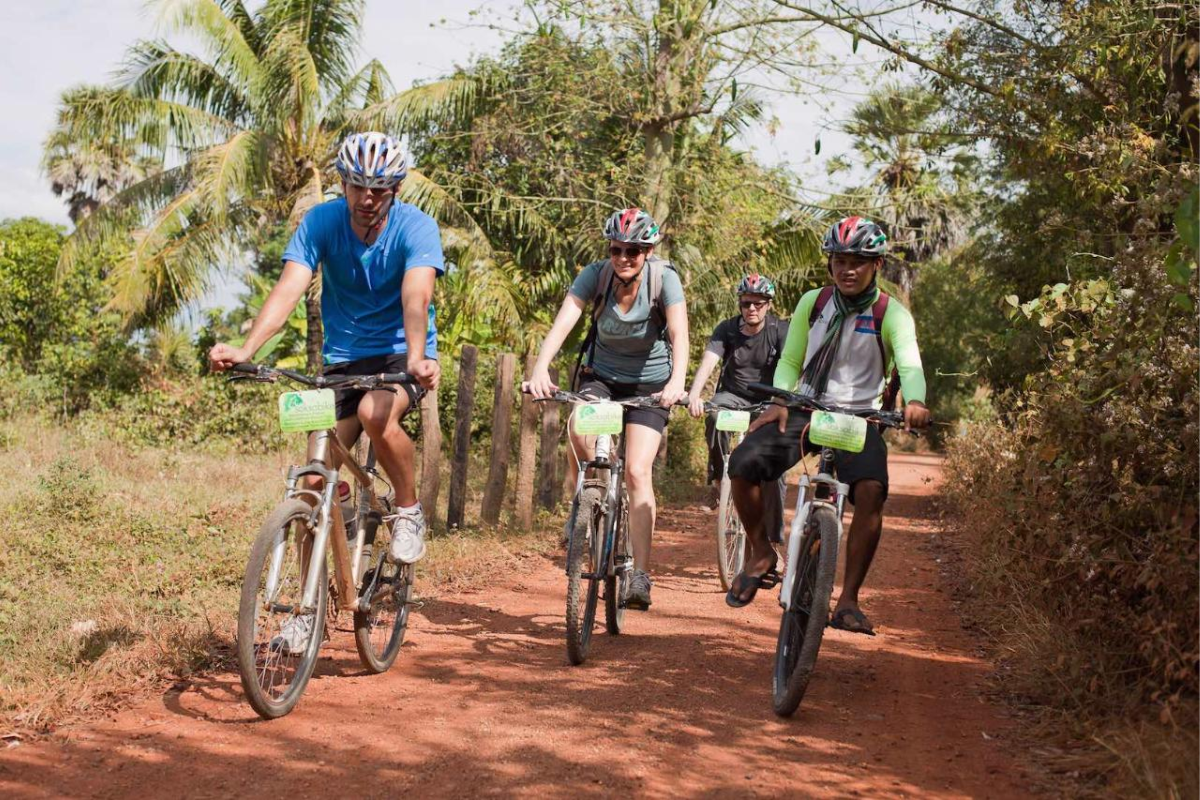 Tourists Cycling around Countryside Village in Battambang - World Mate Travel