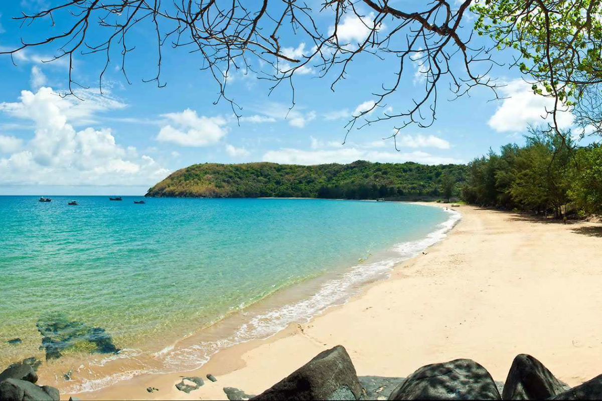 A panoramic view of Dam Trau Beach with turquoise waters and white sand