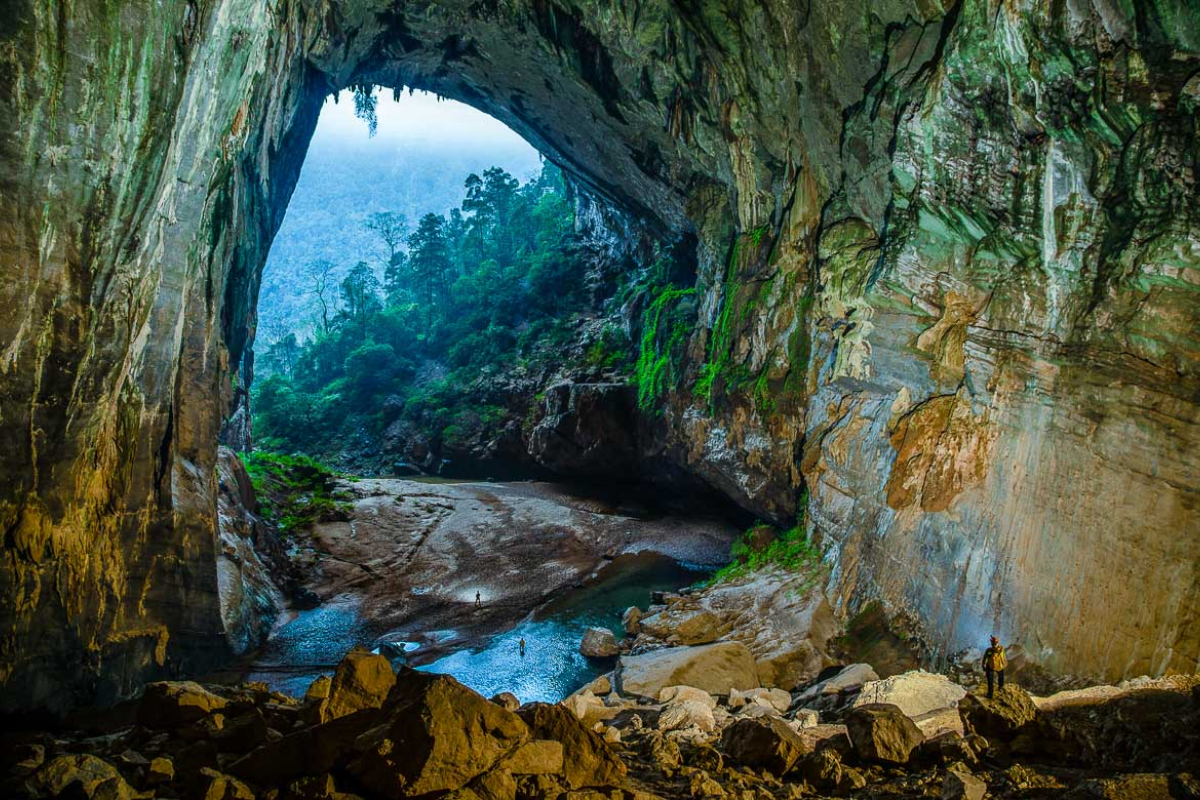 En Cave interior with glowing stalactites and rocky formations