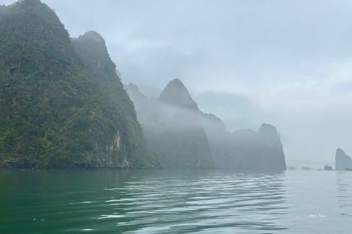Foggy view of limestone karsts in Ha Long Bay during a February morning