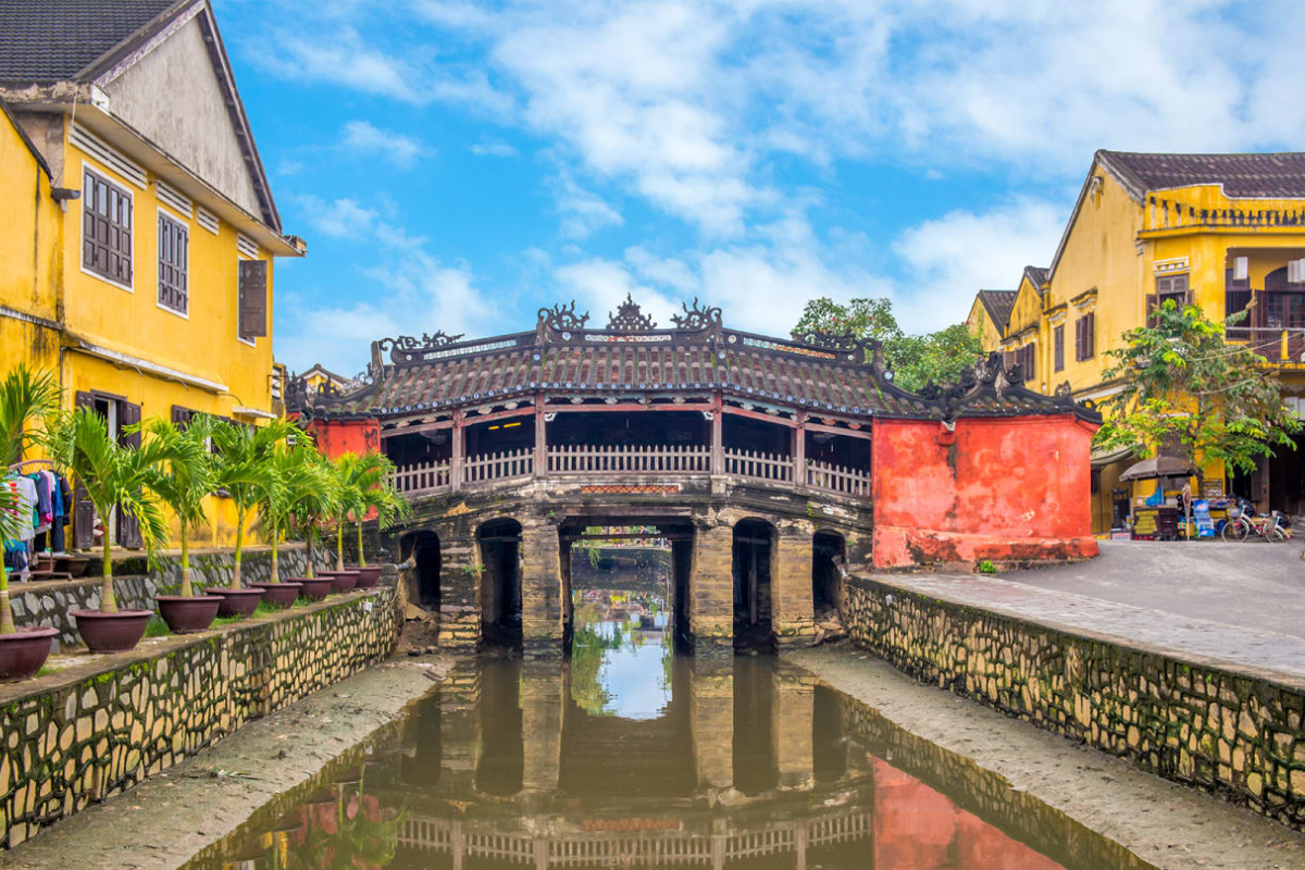 Sunshine over Hoi An Ancient Town in April with clear skies and yellow walls
