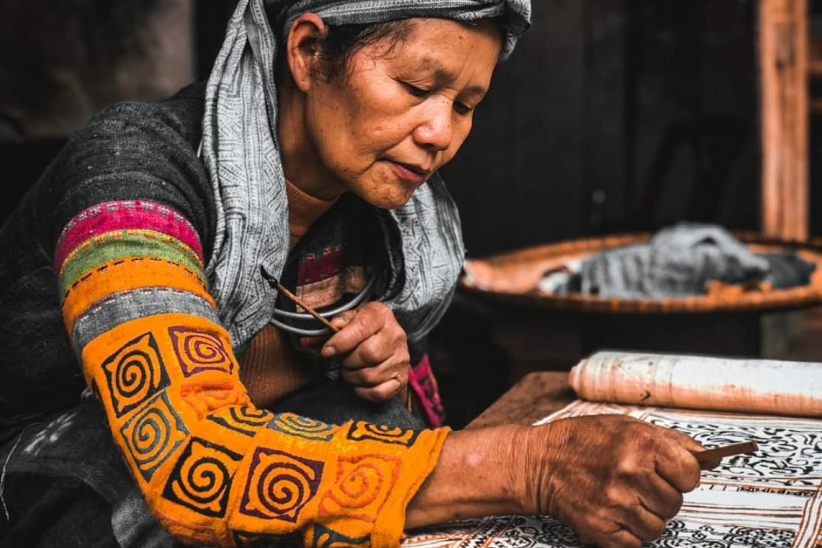 Local woman make handwoven brocade textiles displayed in Lung Tam village, Ha Giang