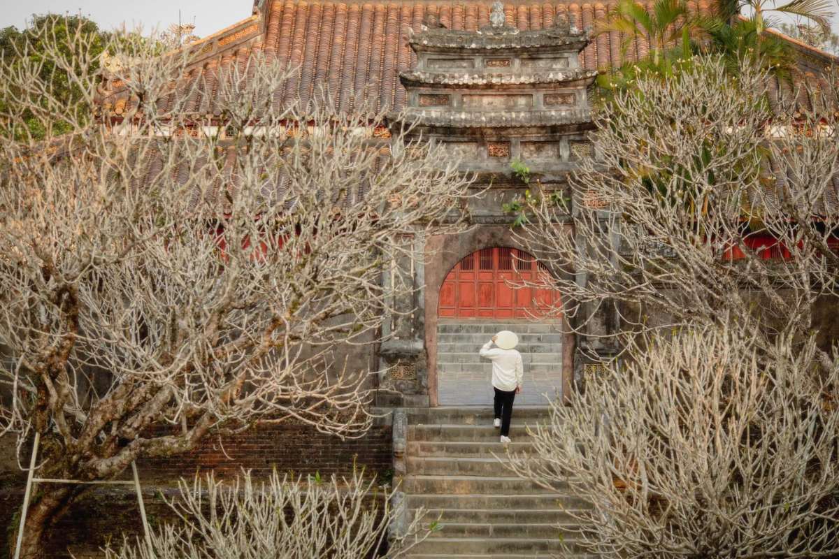Minh Mang Mausoleum surrounded by greenery and peaceful ambiance in December