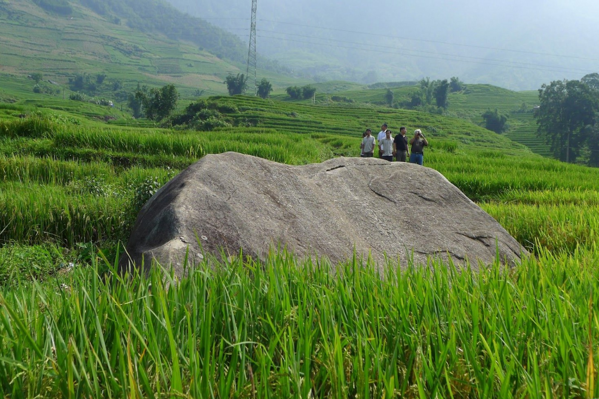 Ancient carved stones with mysterious inscriptions at the rock field in Muong Hoa Valley, Sapa