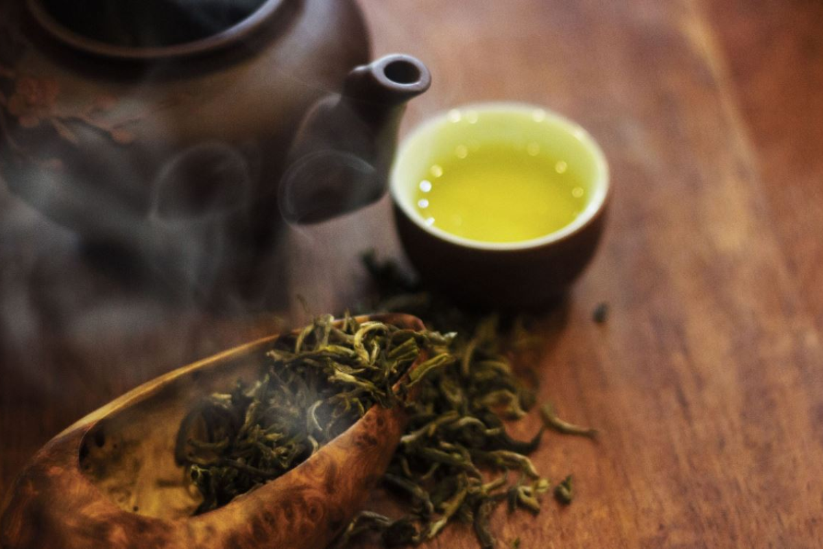 Loose leaves and warm cup of Shan Tuyet tea, a rare specialty from Ha Giang’s ancient tea trees