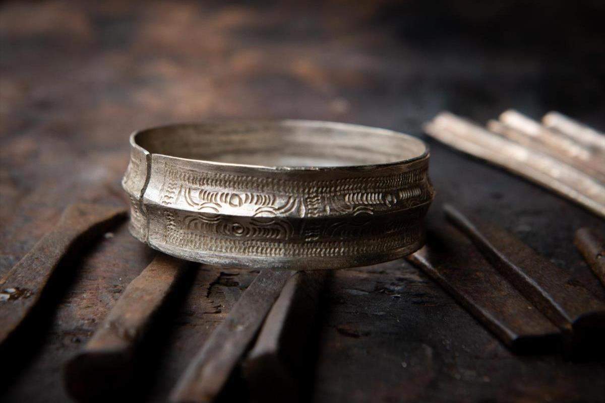 Handcrafted silver rings and bracelets made by Hmong artisans in Lao Xa village