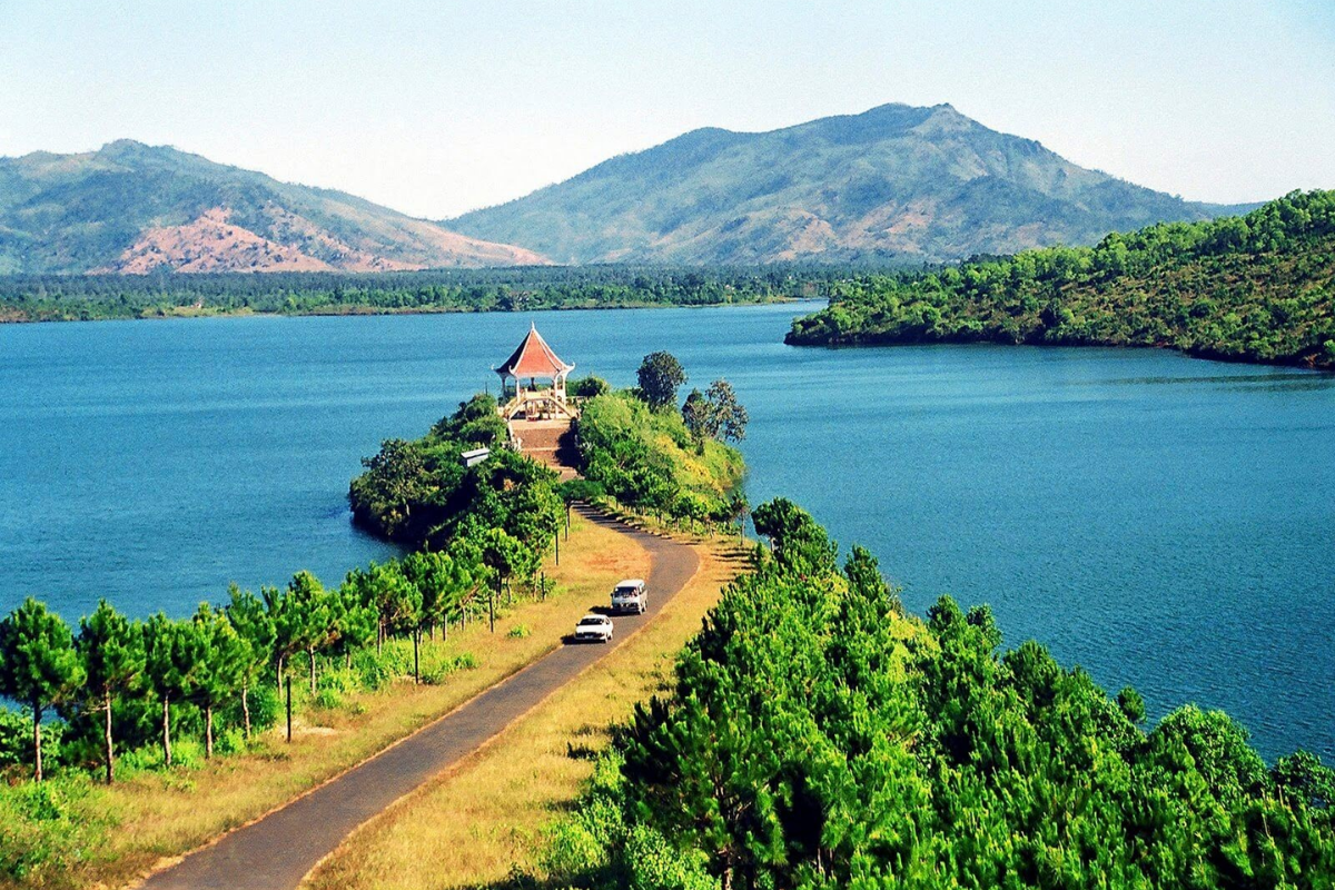 To Nung Lake in Pleiku surrounded by lush greenery and clear skies