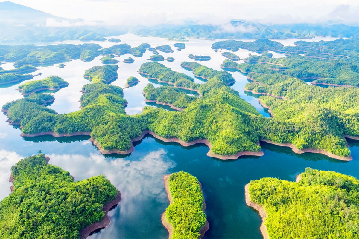 Panoramic view of Ta Dung Lake with small islands and surrounding hills