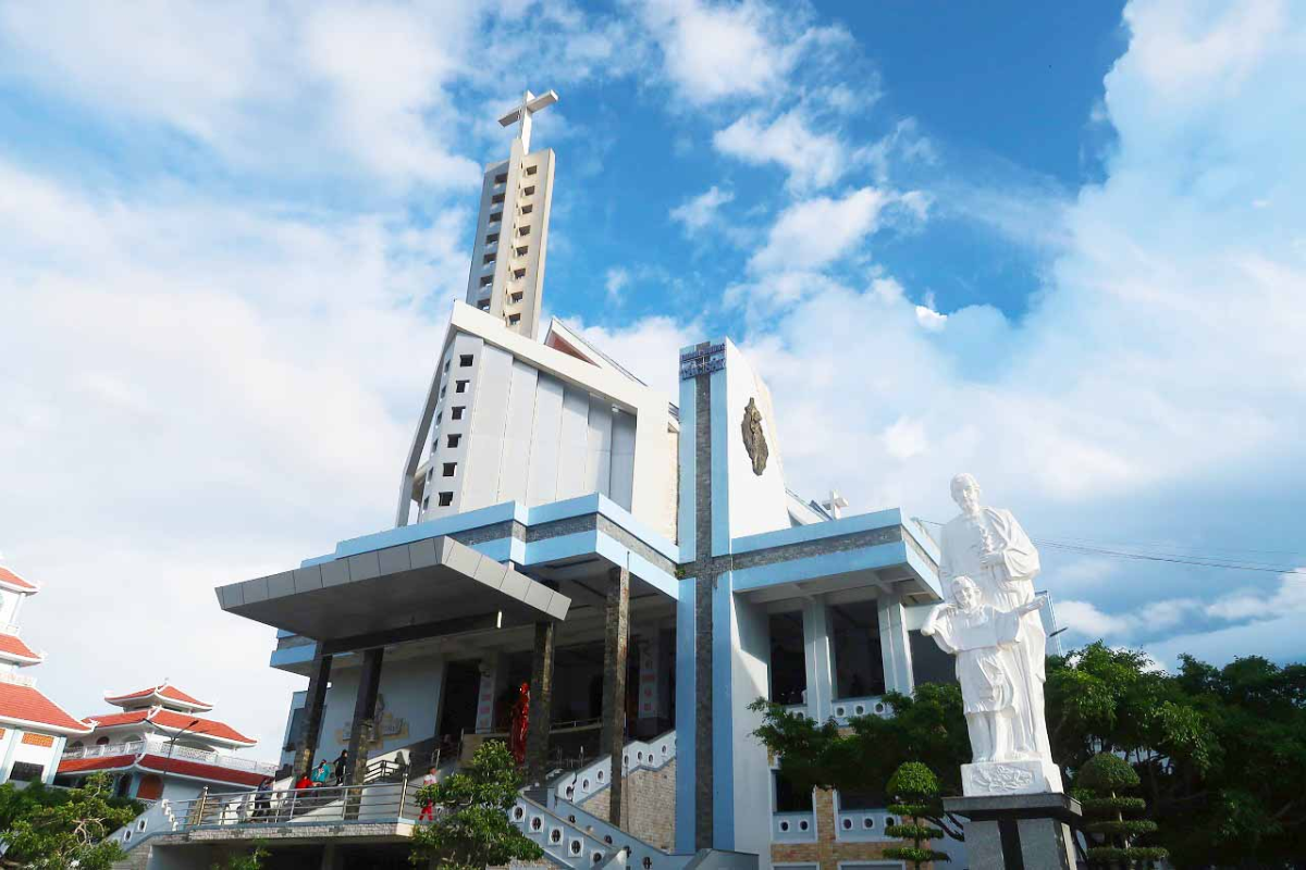 Tac Say Church in Bac Lieu with clock tower and 3-tiered roof design