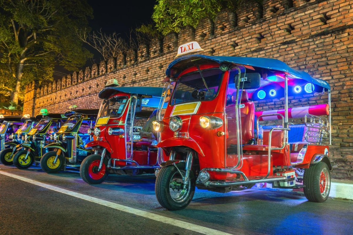 Colorful tuk-tuk driving through Bangkok’s streets