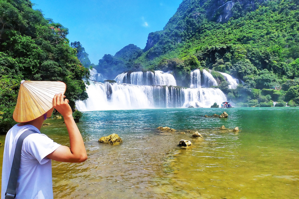 Autumn colors framing Ban Gioc Waterfall in October