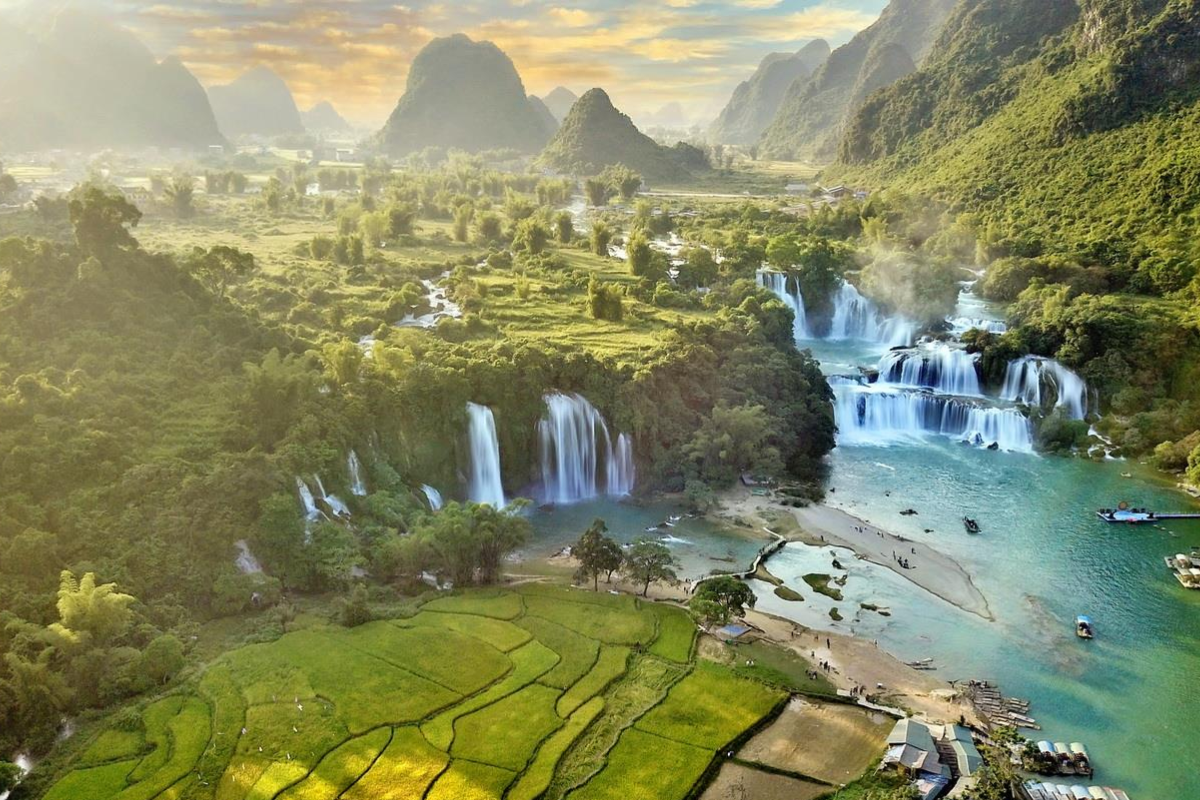 Lush green Ban Gioc Waterfall cascading in full flow during July