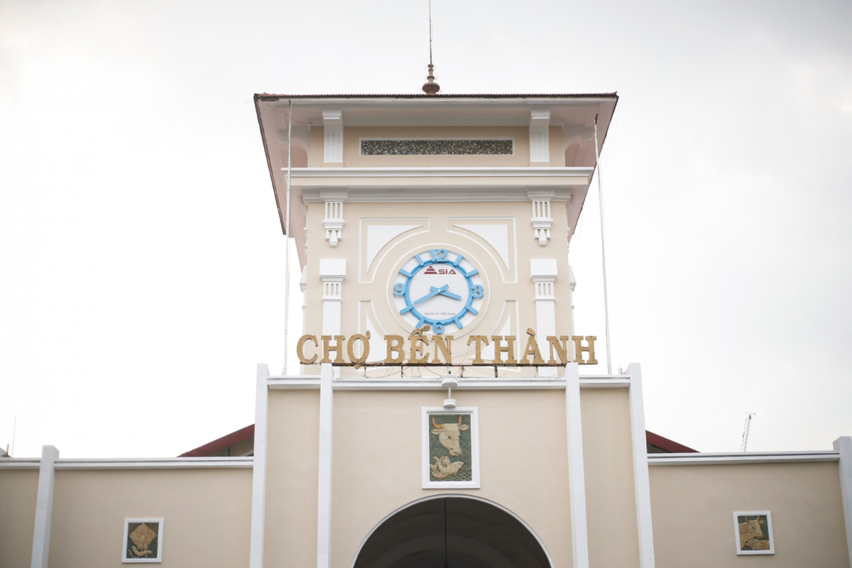 Front view of Ben Thanh Market in Ho Chi Minh City with its iconic clock tower and bustling atmosphere
