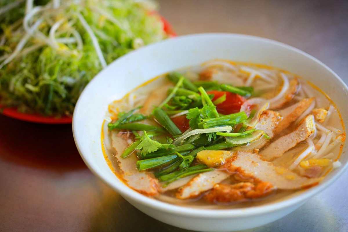 Bowl of Bun Cha Ca with fish cakes and aromatic broth
