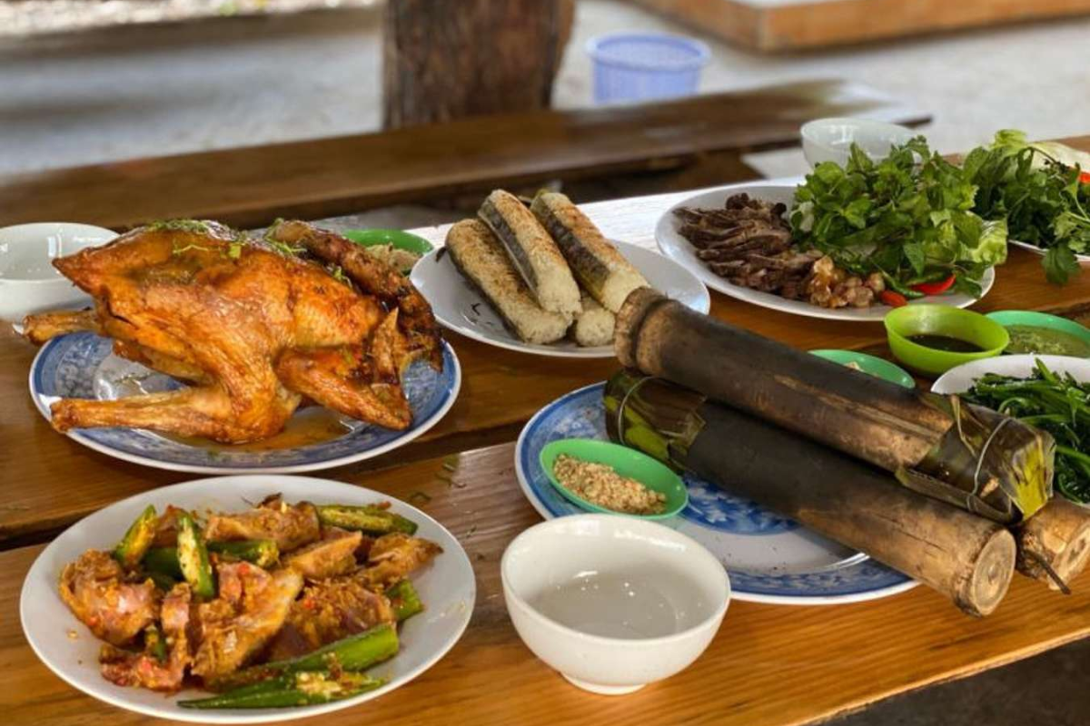Traditional Thai cuisine including sticky rice and grilled forest chicken