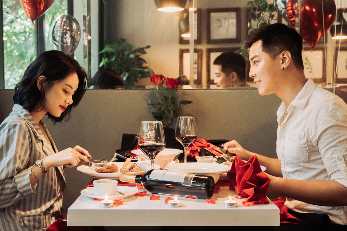 Couple enjoying romantic dinner in Hanoi garden restaurant