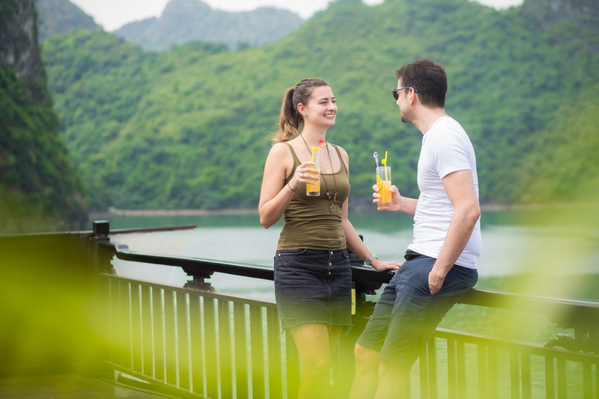 Luxury cruise sailing in Halong Bay at sunset