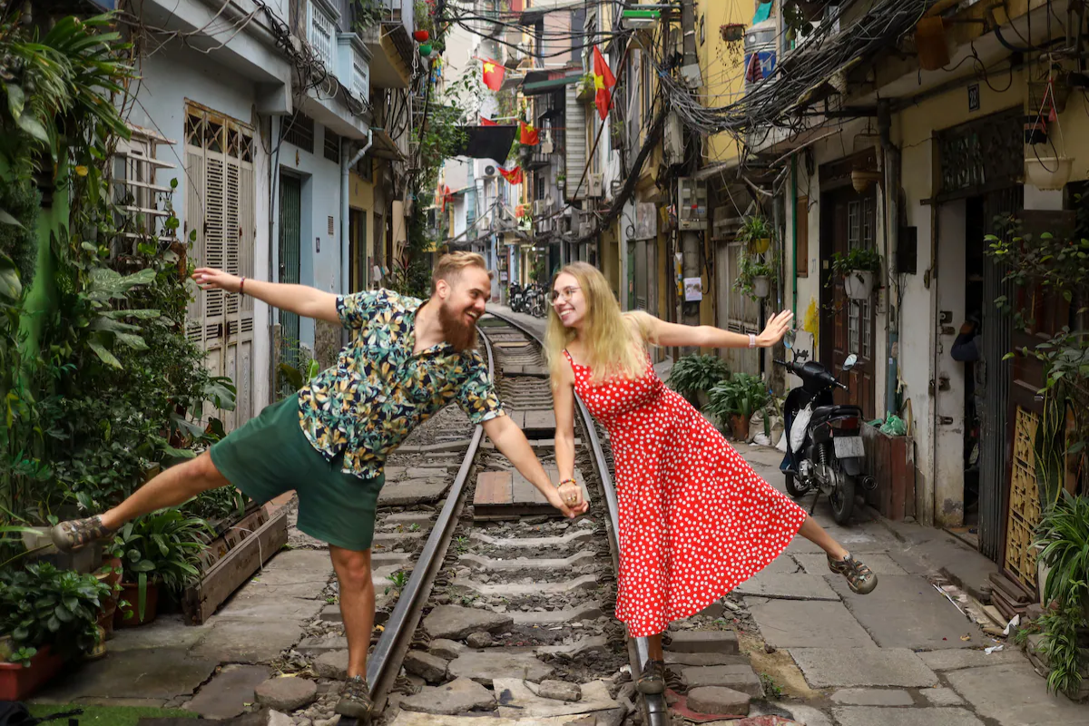 Couple strolling at Hanoi Train Street