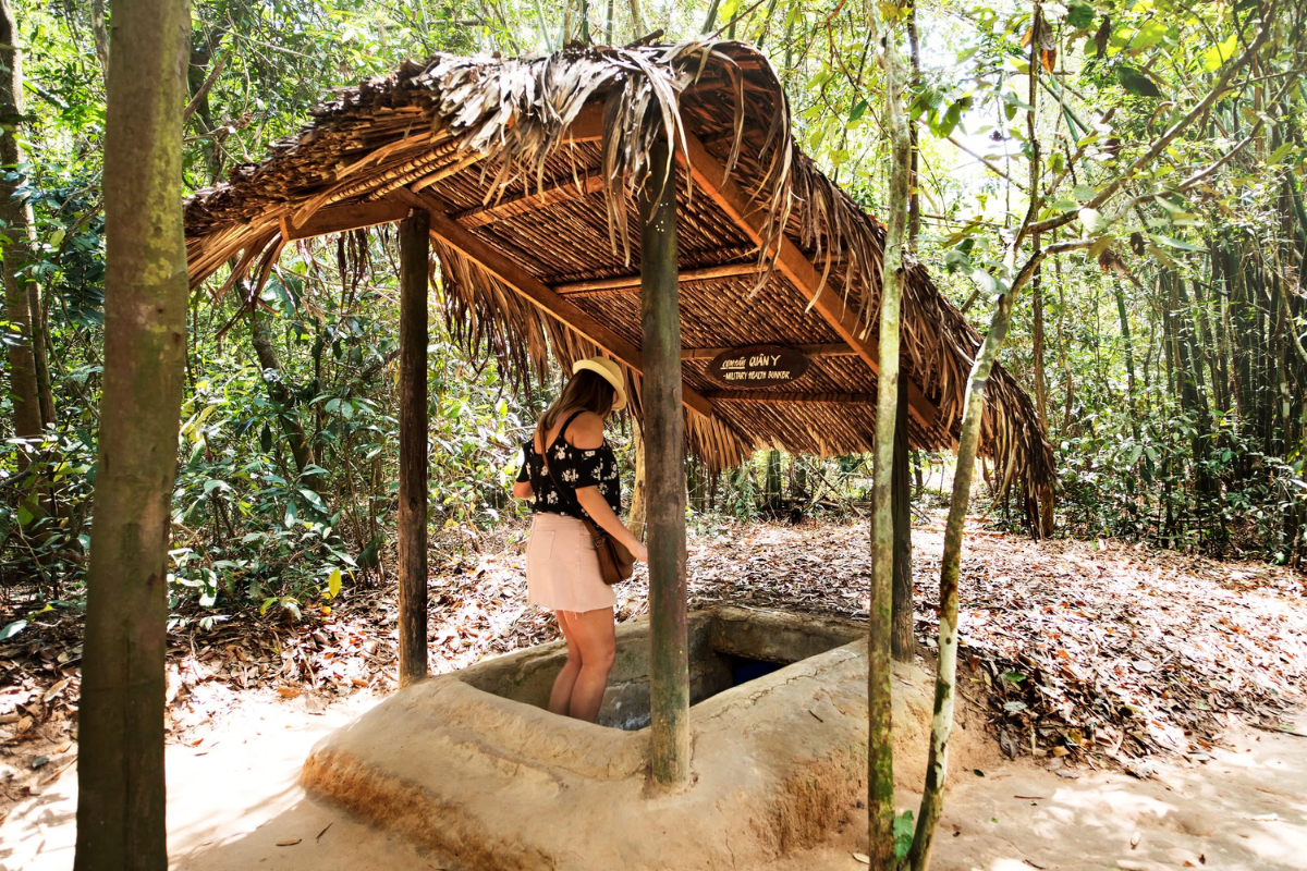 Tourist entering Cu Chi Tunnel in Ho Chi Minh City countryside during dry season