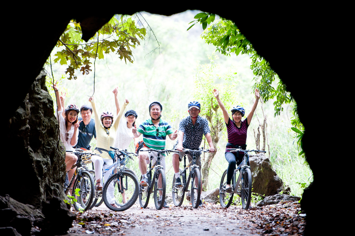 Cyclist exploring forest trail in Cat Ba National Park