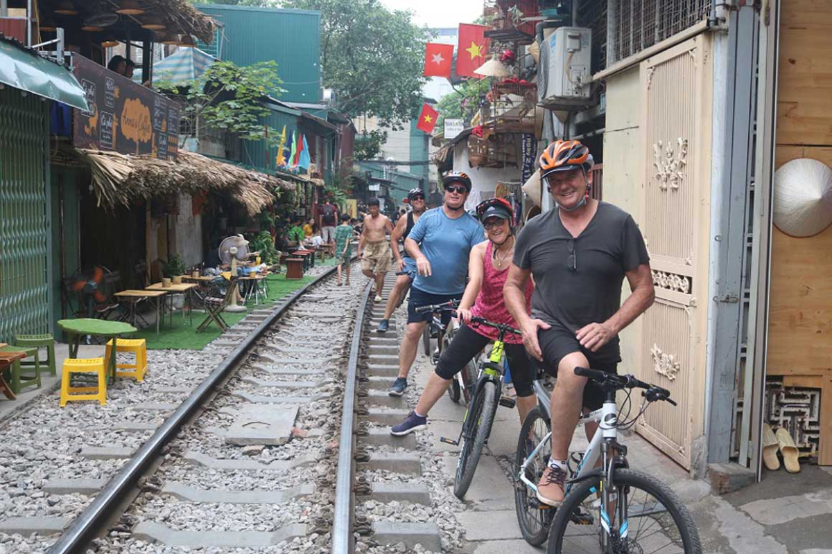 Cyclists exploring Hanoi Old Quarter