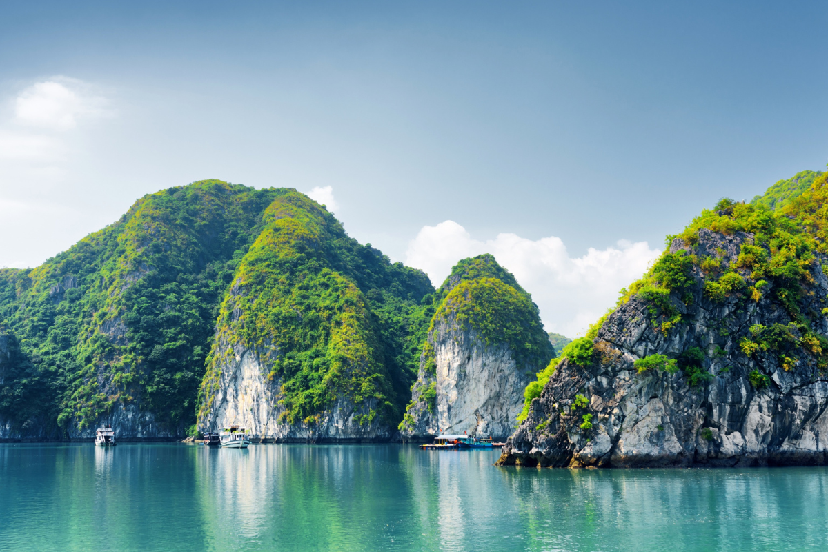 Cloudy summer sky over Ha Long Bay in August with limestone karsts