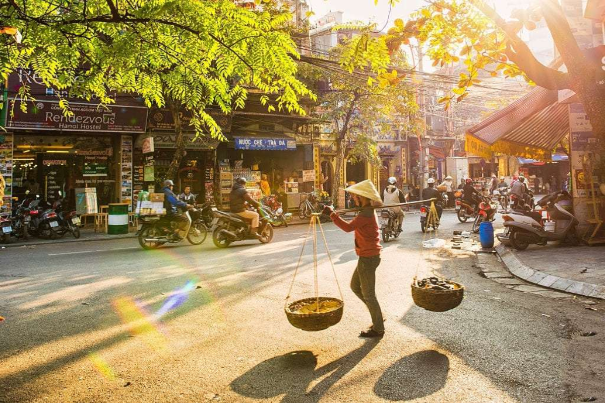 Sunlit streets of Hanoi's Old Quarter in June