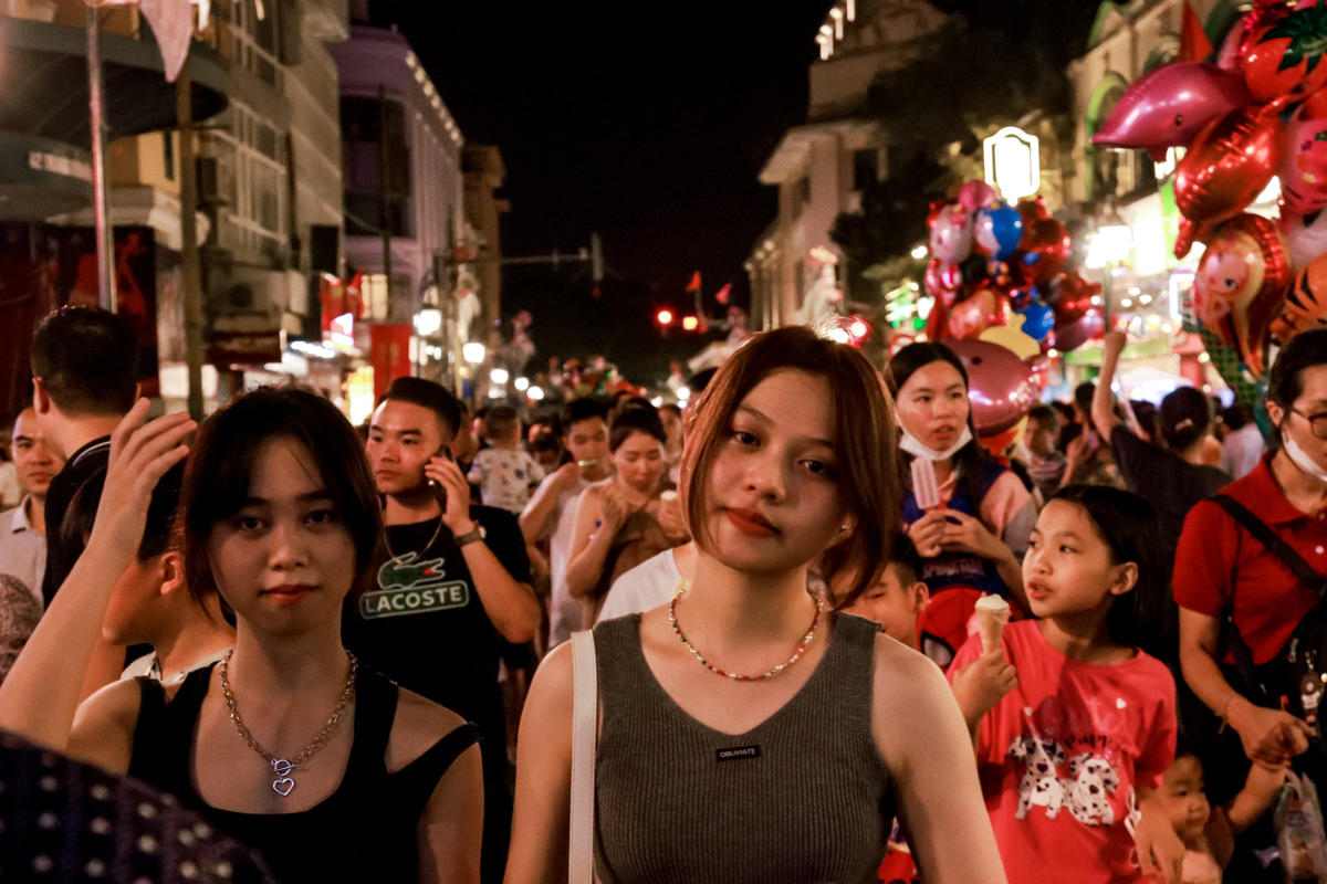 Locals enjoying an evening walk by Hoan Kiem Lake