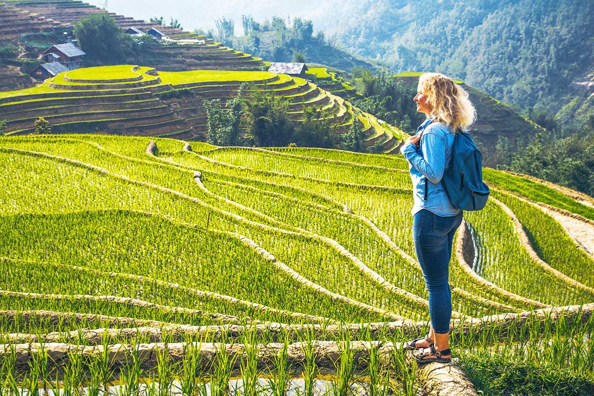 Trekking through terraced rice fields in Sapa, Northern Vietnam