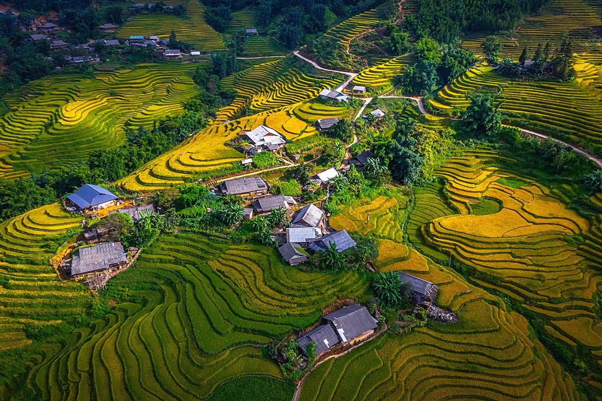 Scenic view of Ho Village with stilt houses and terraced fields