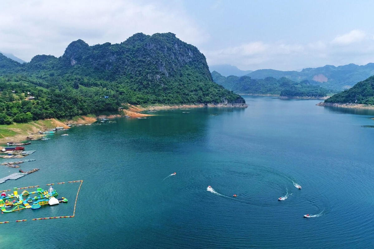 Scenic view of Hoa Binh Lake with forested hills in the background
