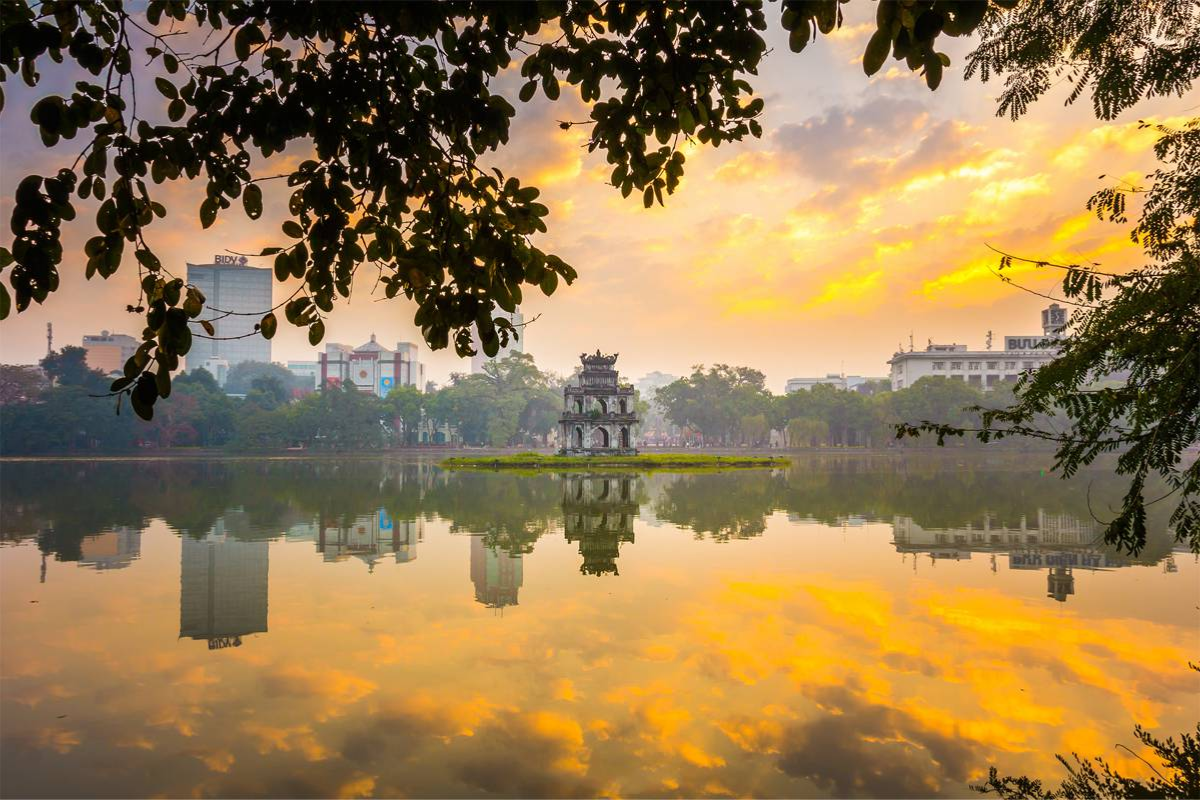Tranquil view of Hoan Kiem Lake with winter mist in Hanoi