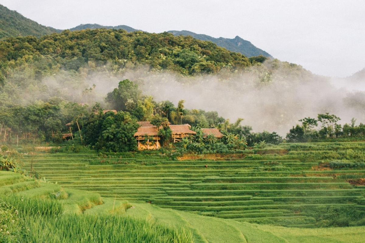 Aerial view of Kho Muong Village surrounded by lush mountains in Pu Luong Nature Reserve, Thanh Hoa Province