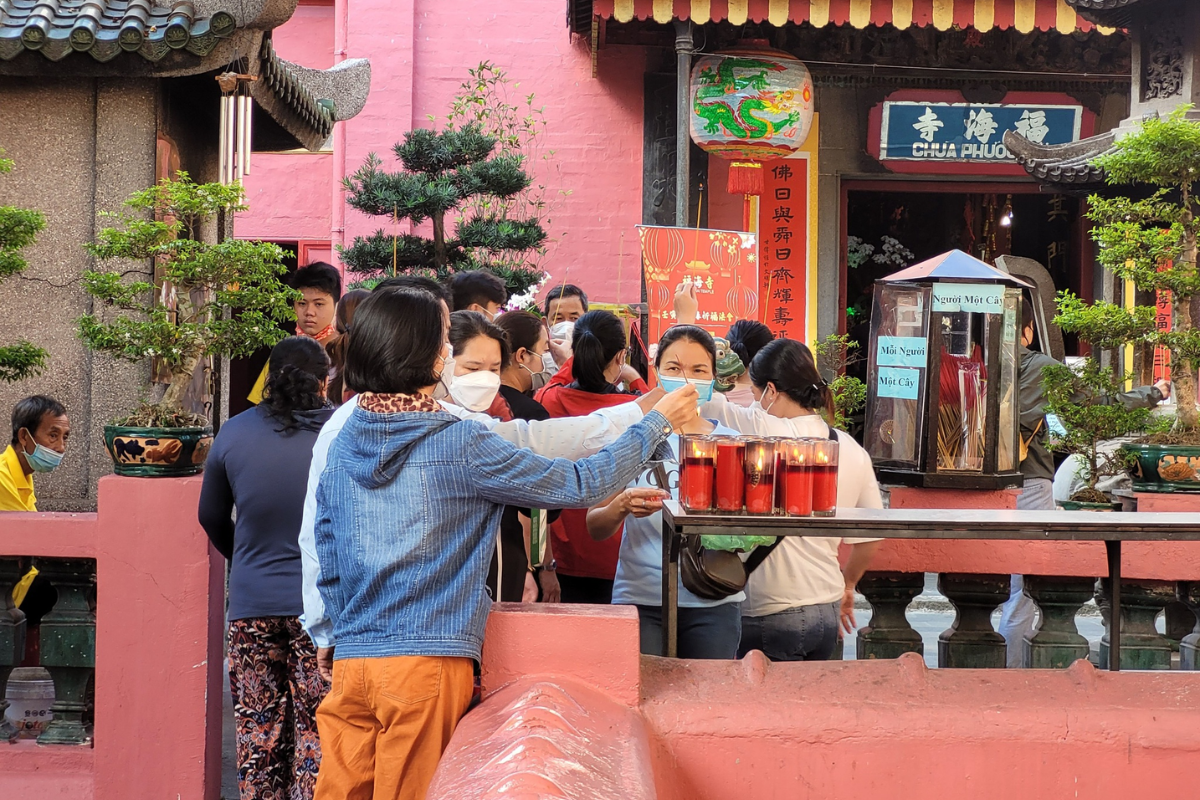 Vietnamese people visiting pagoda during Tet in February in Ho Chi Minh City