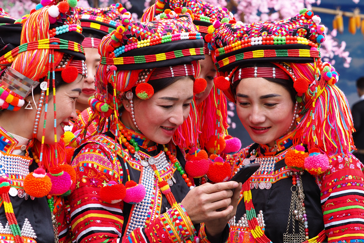 local villagers in traditional costume in Dien Bien ethnic village