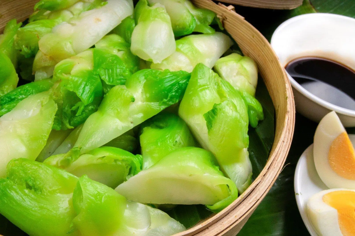 Boiled Mam Da cabbage served with sesame sauce and egg in a traditional dish in Sapa