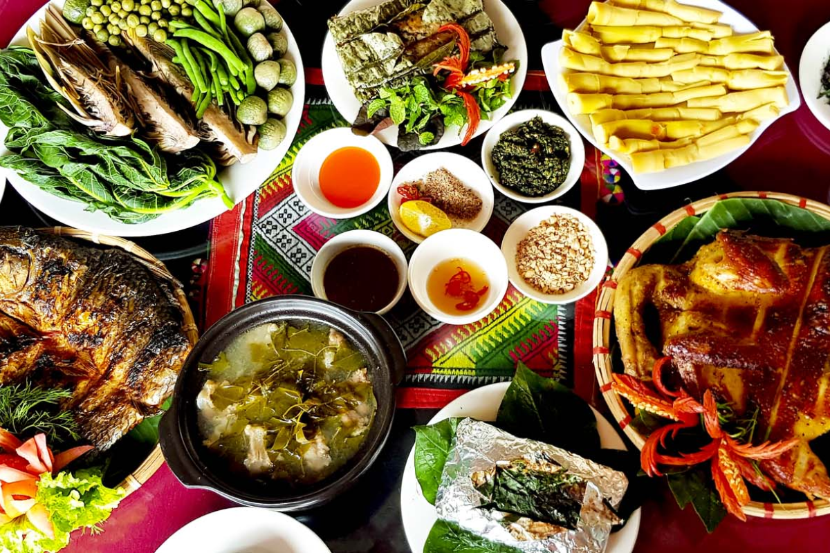Traditional Moc Chau meal featuring local specialties and corn alcohol