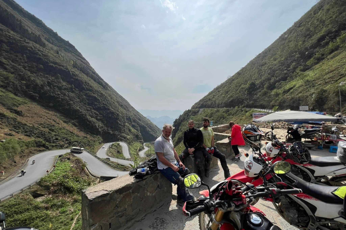 Motorcyclist admiring the view of Nho Que River from Ma Pi Leng Pass, Ha Giang