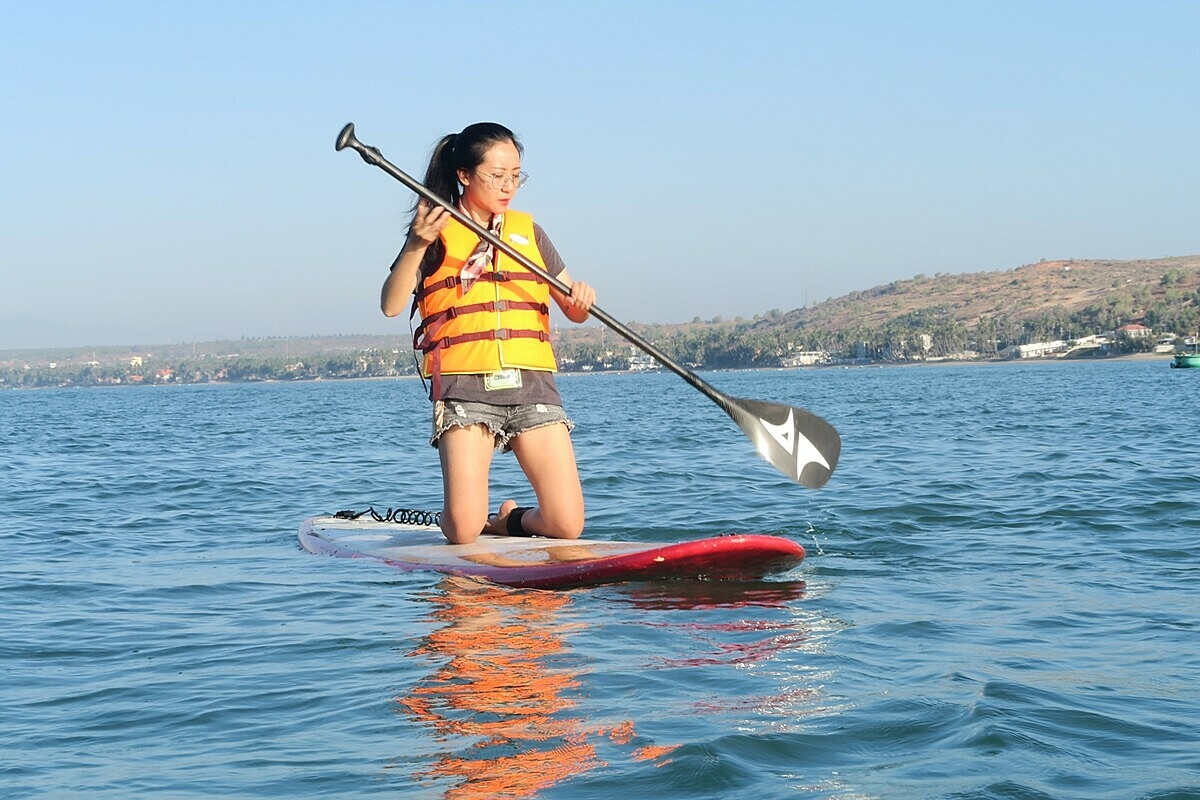 Kayaking adventure along the calm waters near Mui Ne Fishing Village