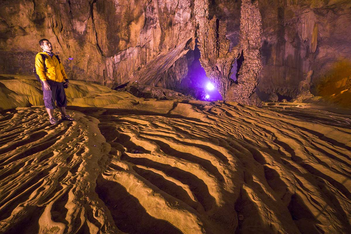 Inside Nguom Ngao Cave with dramatic rock formations in April