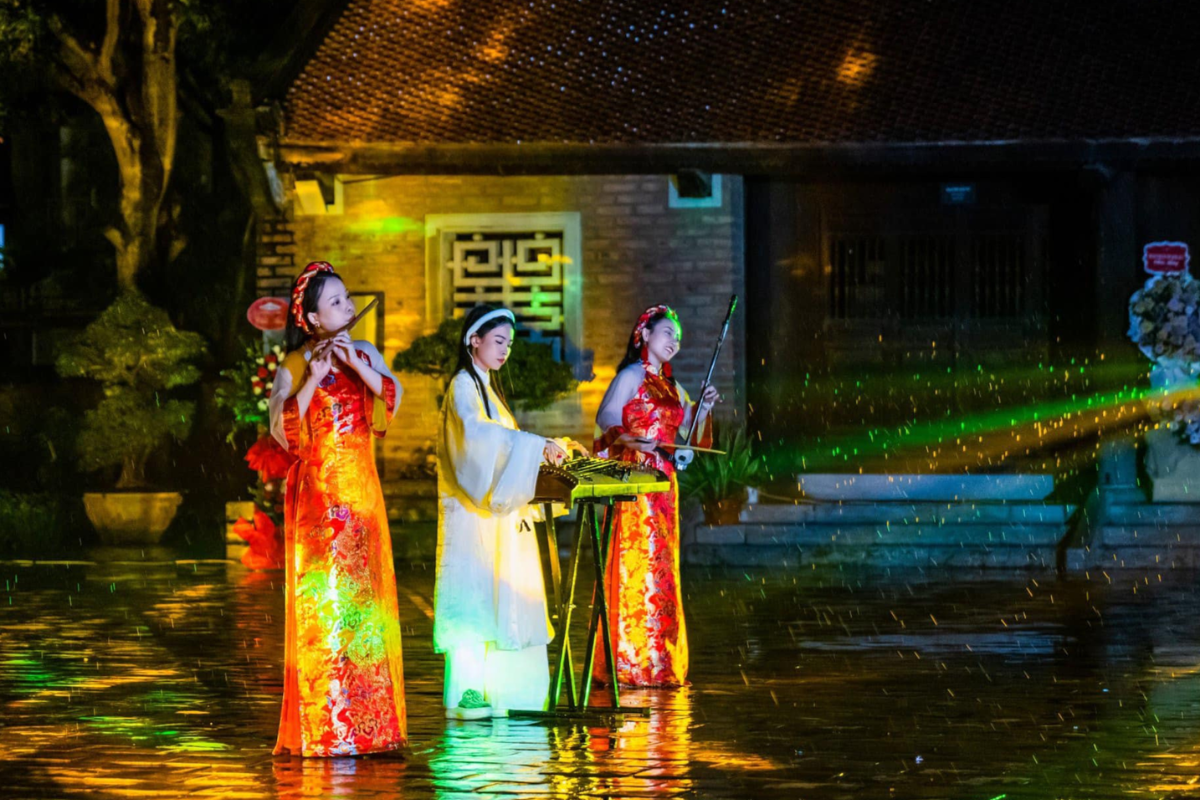 Night tour with 3D light mapping show at Temple of Literature Hanoi, illuminating ancient structures with vivid visuals
