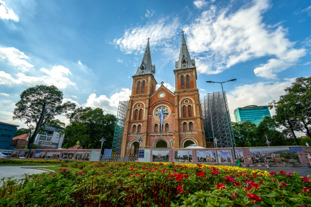 In front of Notre-Dame Cathedral in Saigon on a rainy day