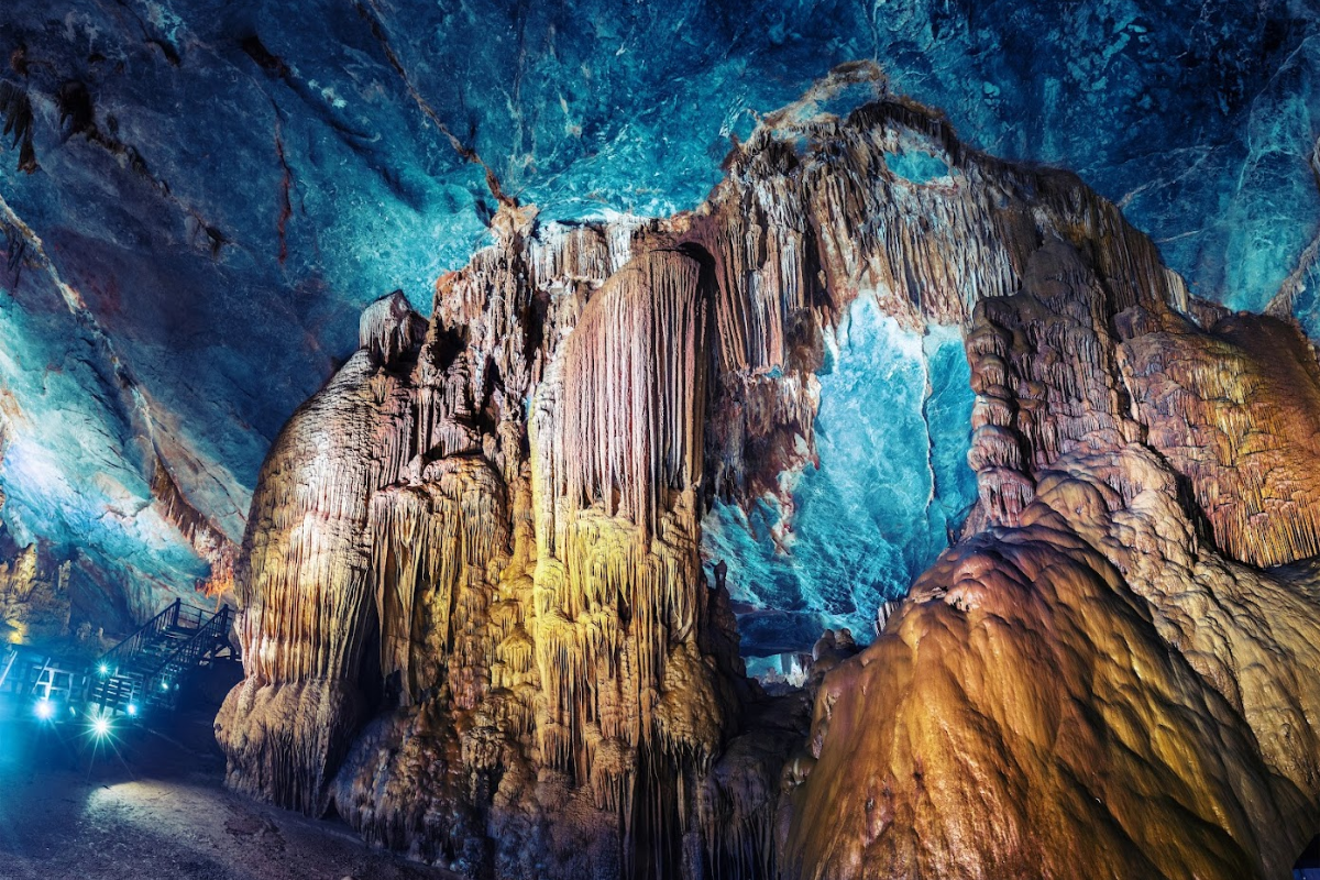 Inside Paradise Cave with dramatic stalactite and stalagmite formations