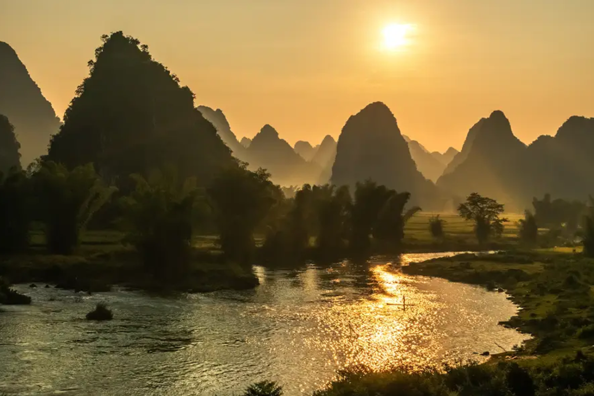 Quay Son River flowing peacefully near ethnic villages in Cao Bang during autumn