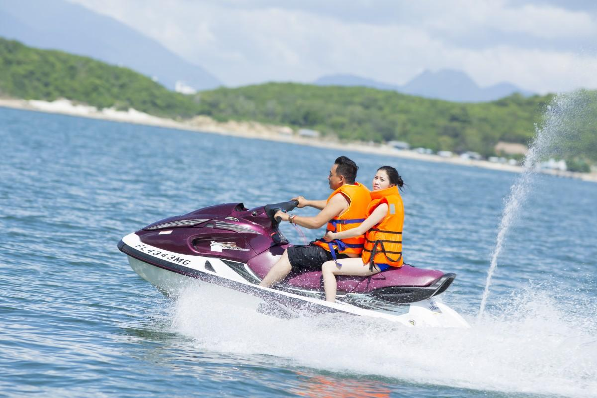 Tourists riding jet skis on the open sea near Hon Rom Island
