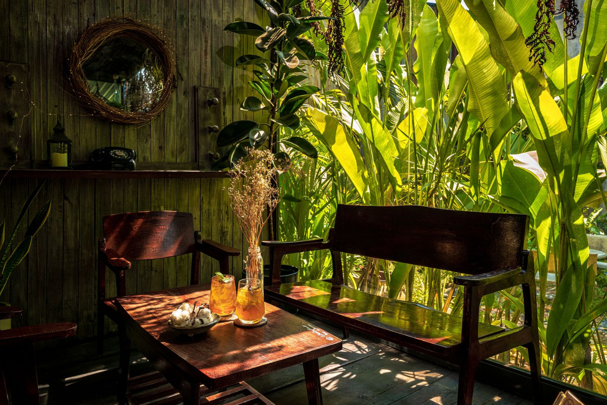 Customers enjoying coffee at a cozy cafe in Ho Chi Minh City during a rainy afternoon in August